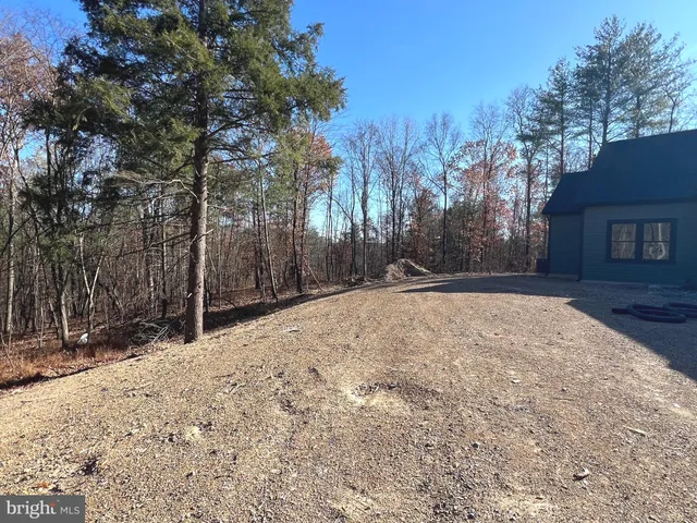 a view of swimming pool with trees in the background