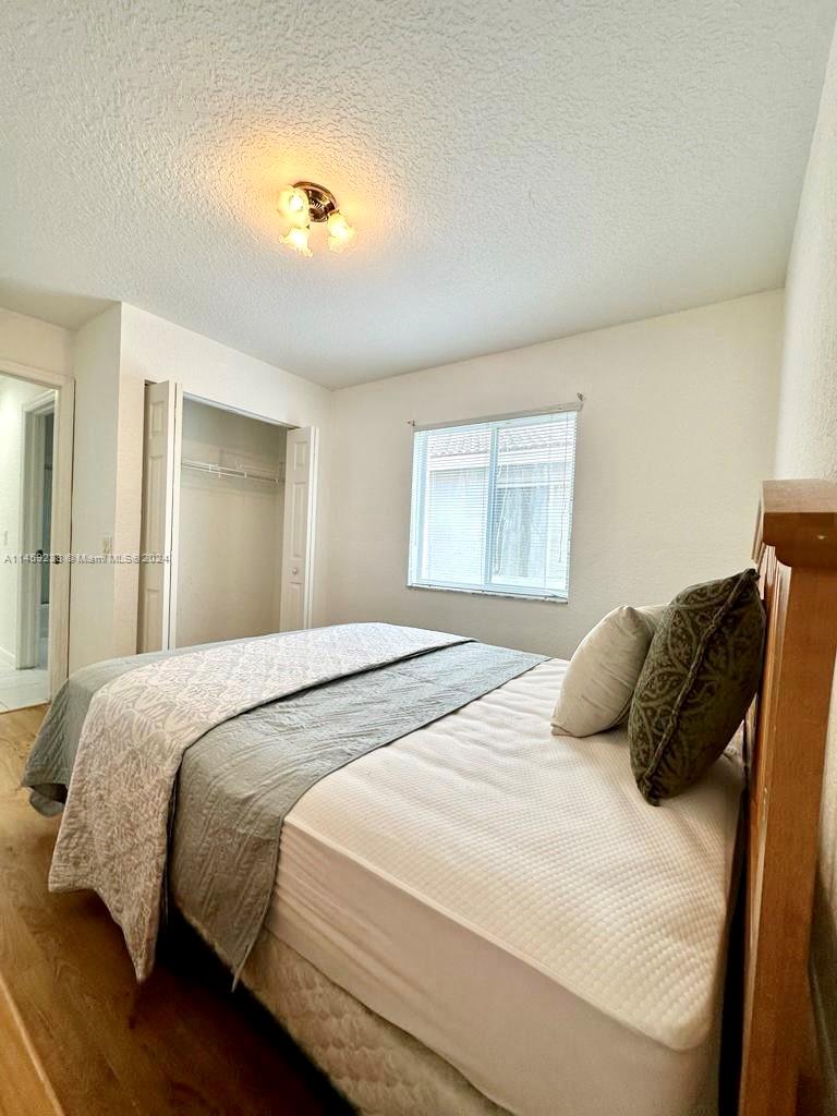 1509 Sunset Way Weston, FL 33327 - Photo 20 of 24 a bedroom with a bed and window