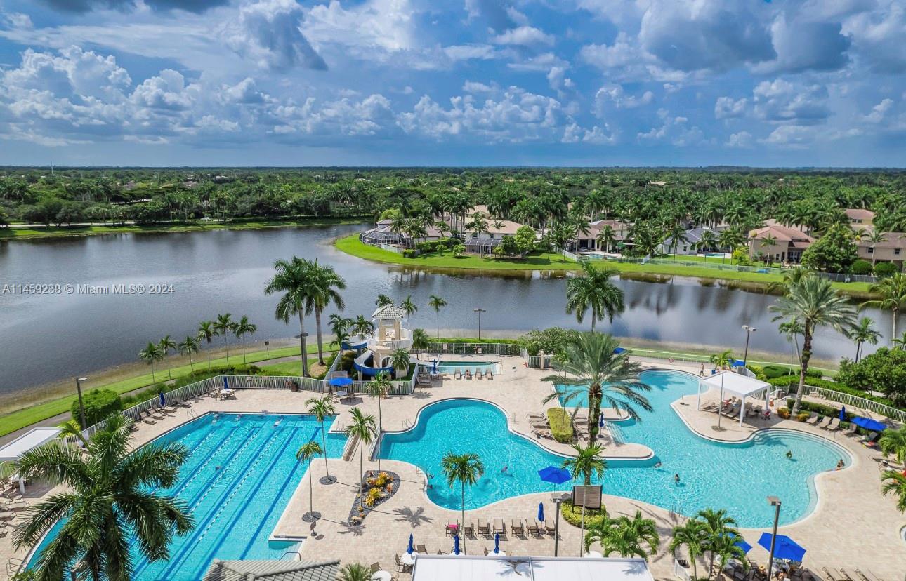 1509 Sunset Way Weston, FL 33327 - Photo 23 of 24 an aerial view of a house with outdoor space and a lake view in back