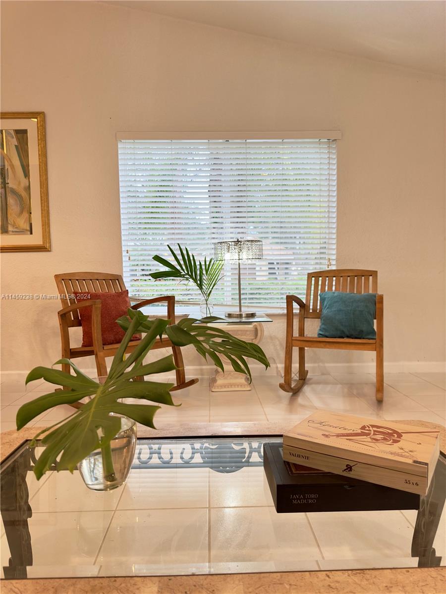 1509 Sunset Way Weston, FL 33327 - Photo 7 of 24 a view of living room with furniture and floor to ceiling window