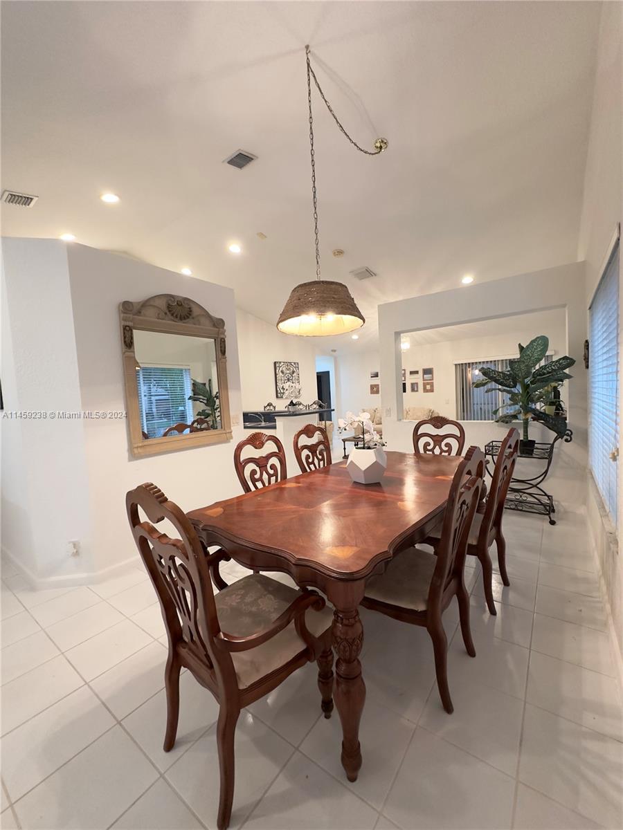 1509 Sunset Way Weston, FL 33327 - Photo 8 of 24 a view of a dining room with furniture