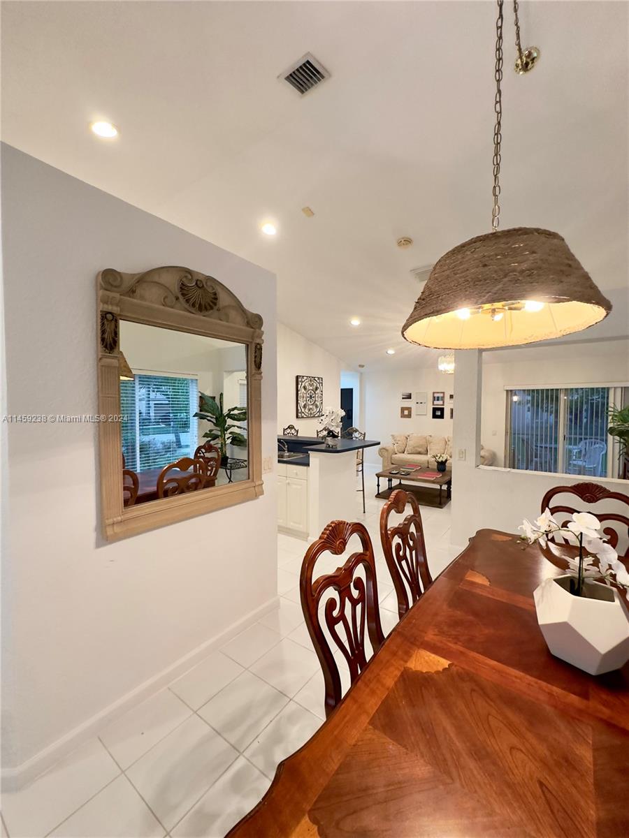 1509 Sunset Way Weston, FL 33327 - Photo 9 of 24 a bedroom with furniture and a large window