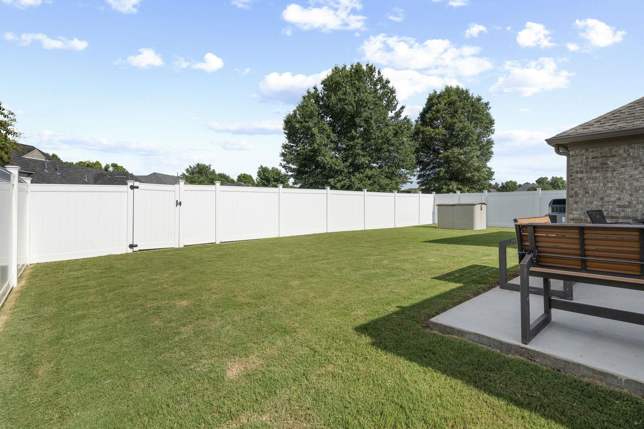 7232 Maple Grove Road Olive Branch, MS 38654 - Photo 12 of 18 Fenced backyard with a patio area and a gate