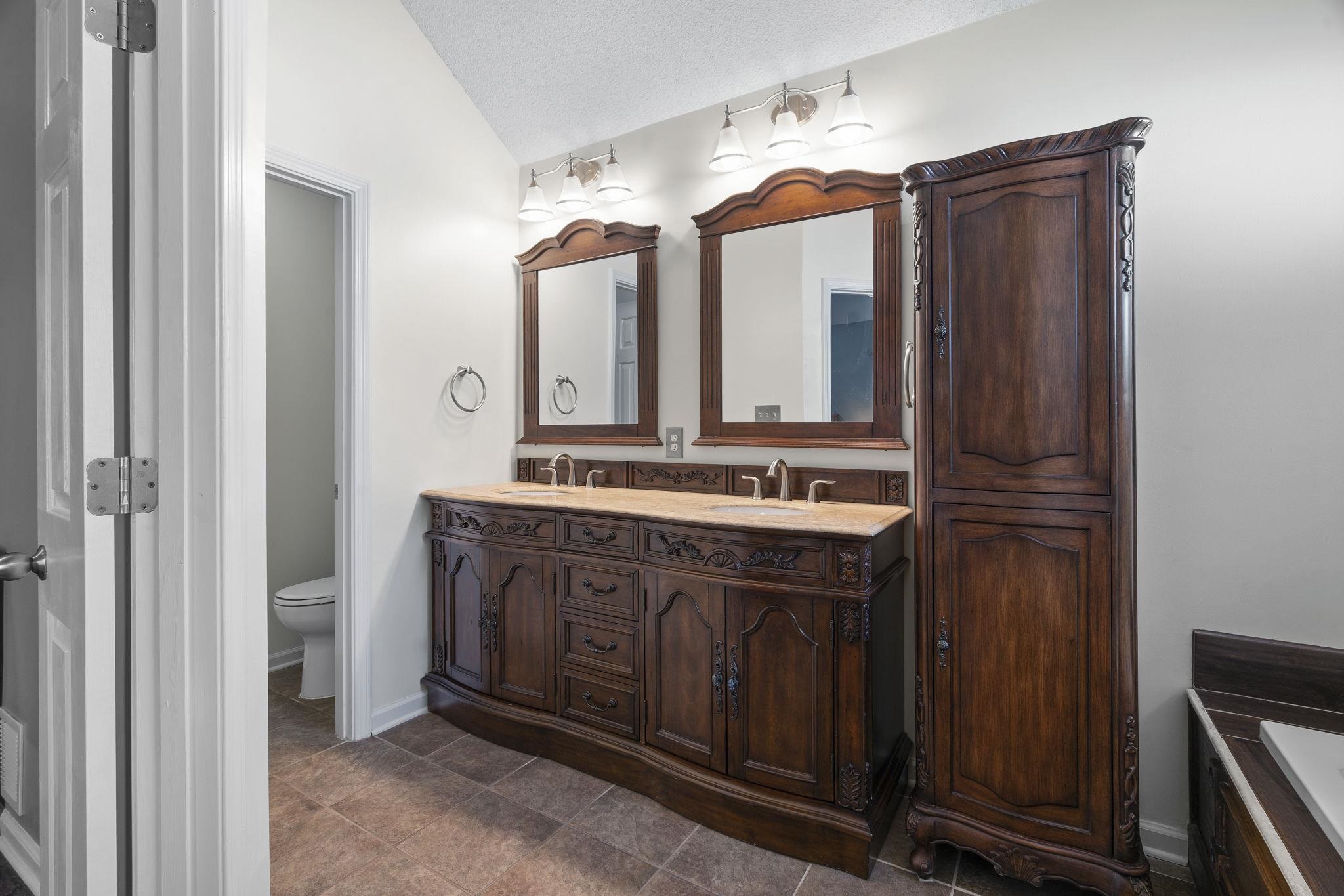 7232 Maple Grove Road Olive Branch, MS 38654 - Photo 14 of 18 Bathroom with a sink and lofted ceiling