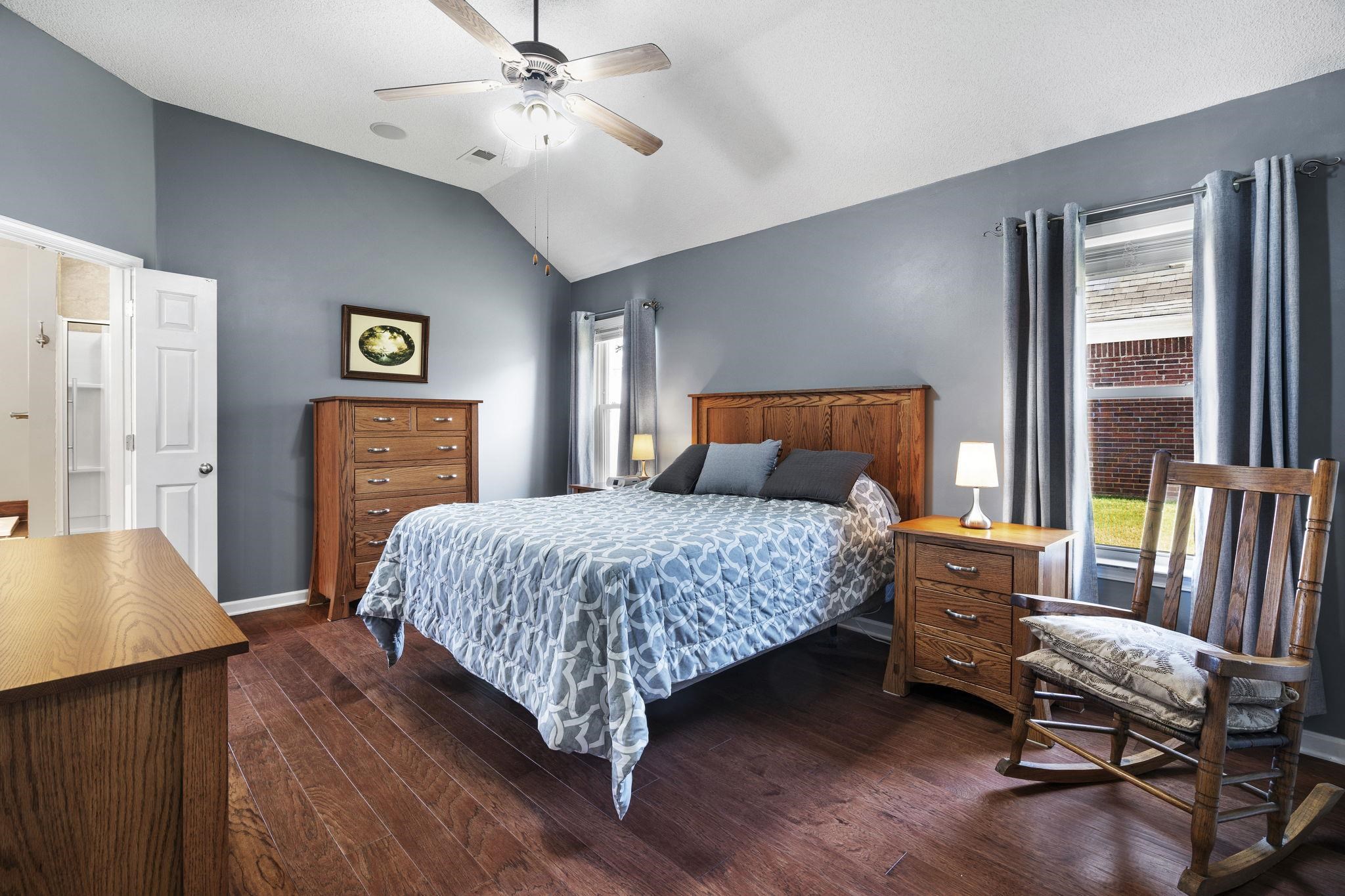 7232 Maple Grove Road Olive Branch, MS 38654 - Photo 8 of 18 Bedroom with dark wood-style flooring, vaulted ceiling, and a ceiling fan