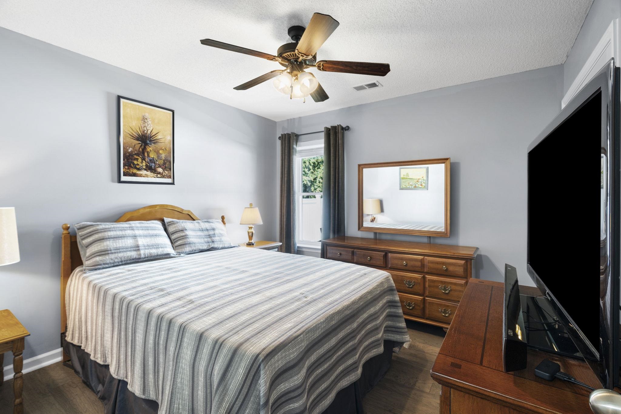 7232 Maple Grove Road Olive Branch, MS 38654 - Photo 9 of 18 Bedroom featuring dark wood-style floors, a textured ceiling, and ceiling fan