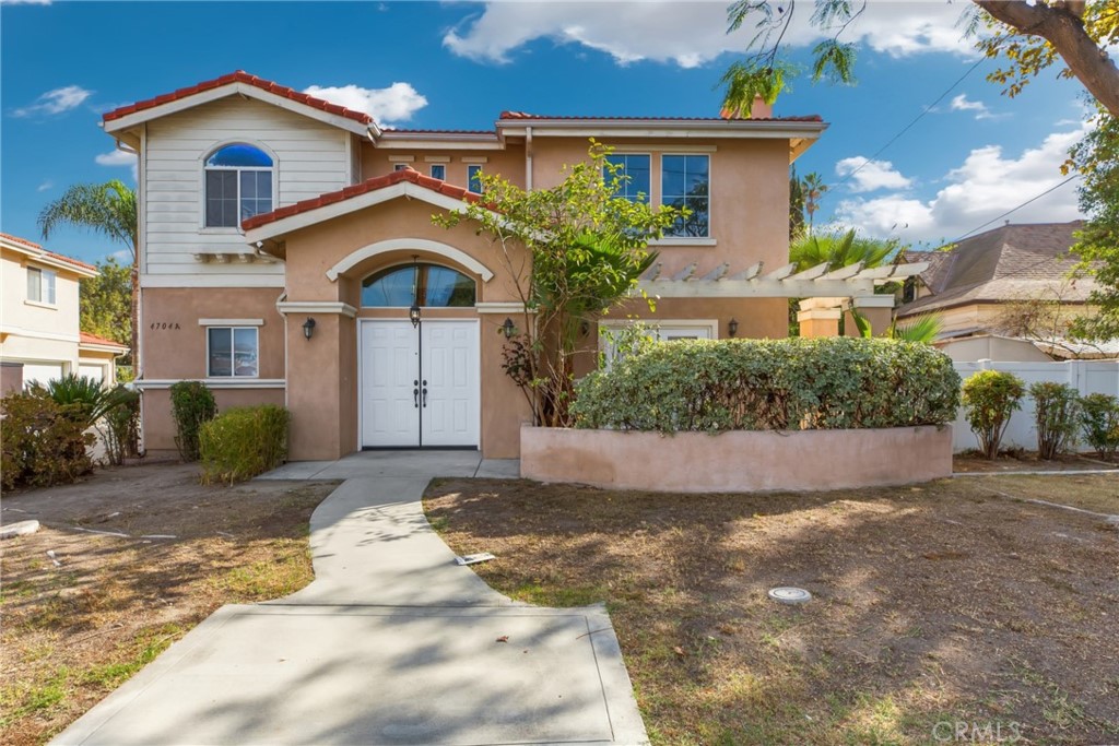 4704 Maxson Road, Unit A El Monte, CA 91732 - Photo 1 of 1 a front view of a house with a yard and a garage