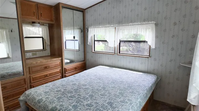a view of kitchen with furniture and a window