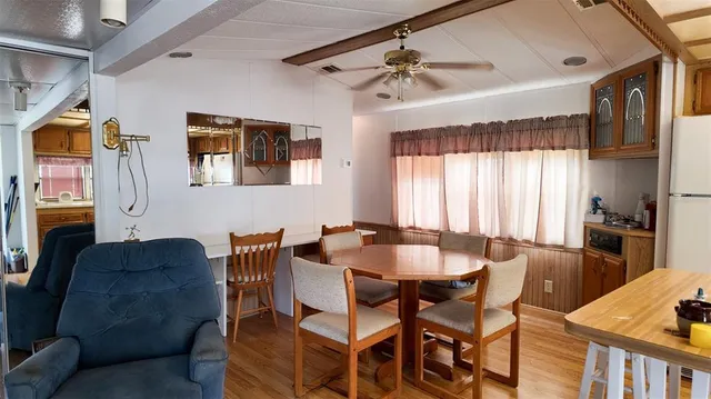 a dining room with furniture and window
