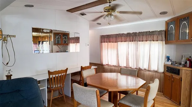 a dining room with a table and chairs