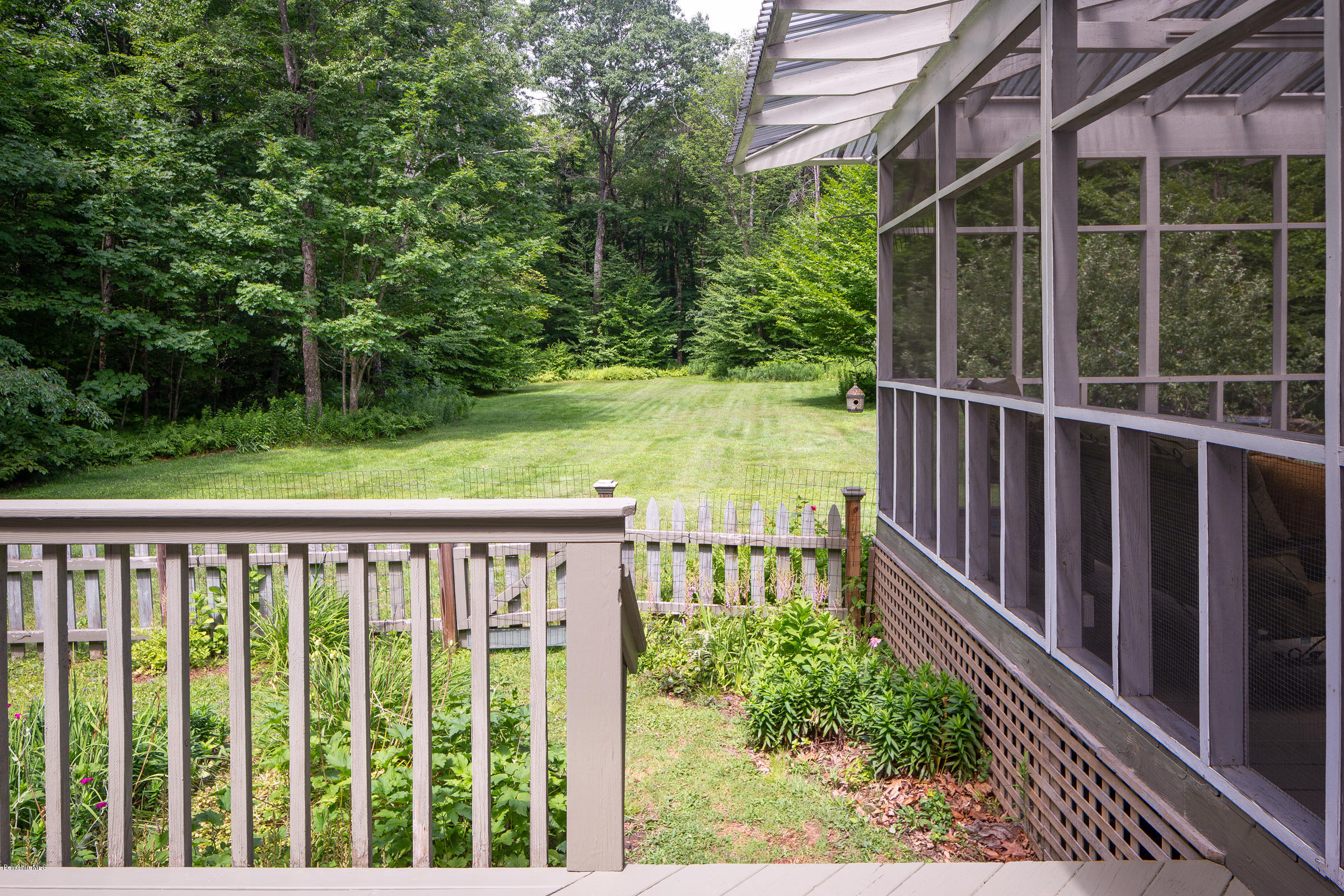 23 Griswold Road Monterey, MA 01245 - Photo 13 of 23 a balcony with yard outdoor seating and trees in the back