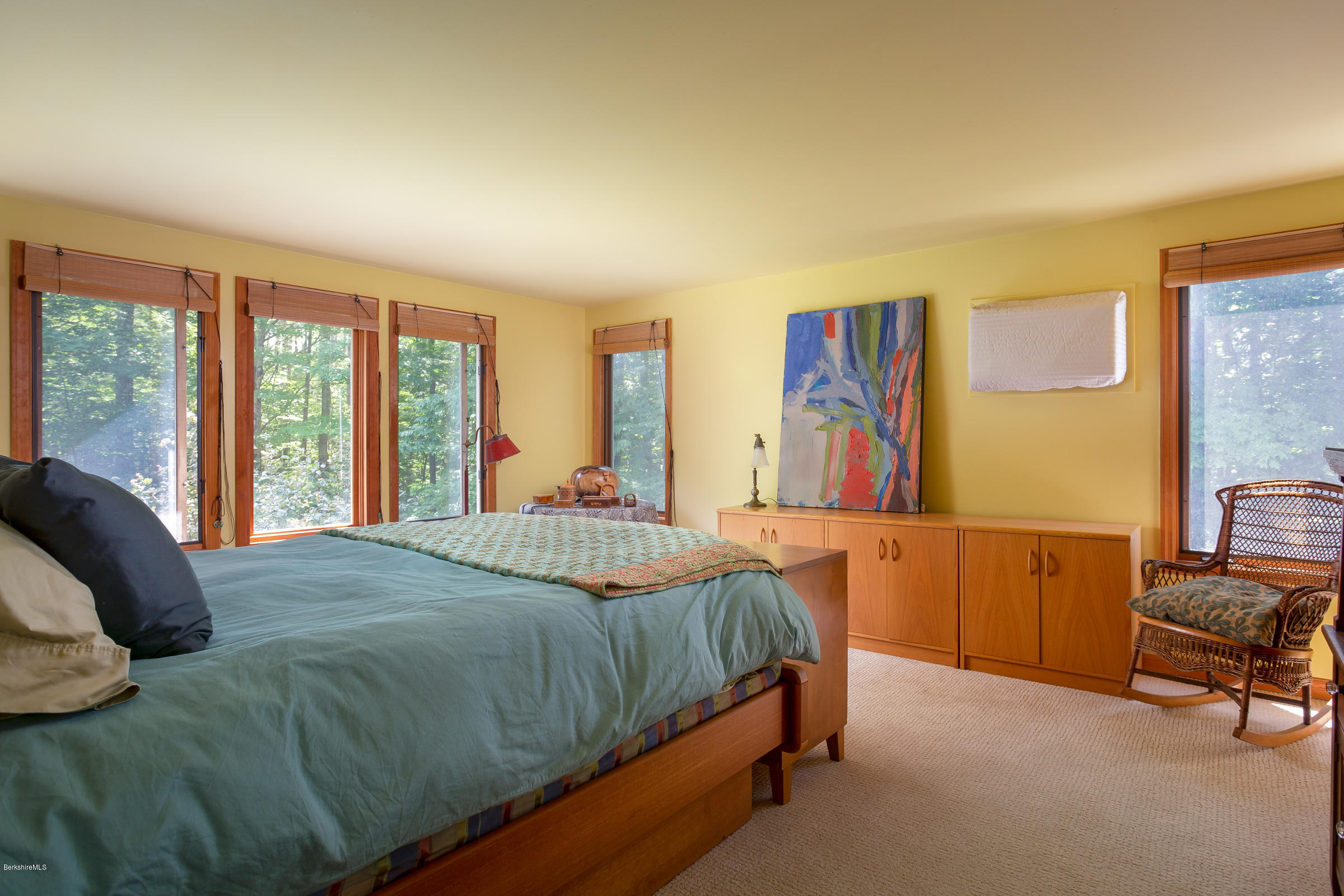 23 Griswold Road Monterey, MA 01245 - Photo 16 of 23 a bedroom with a bed and a dresser next to a window