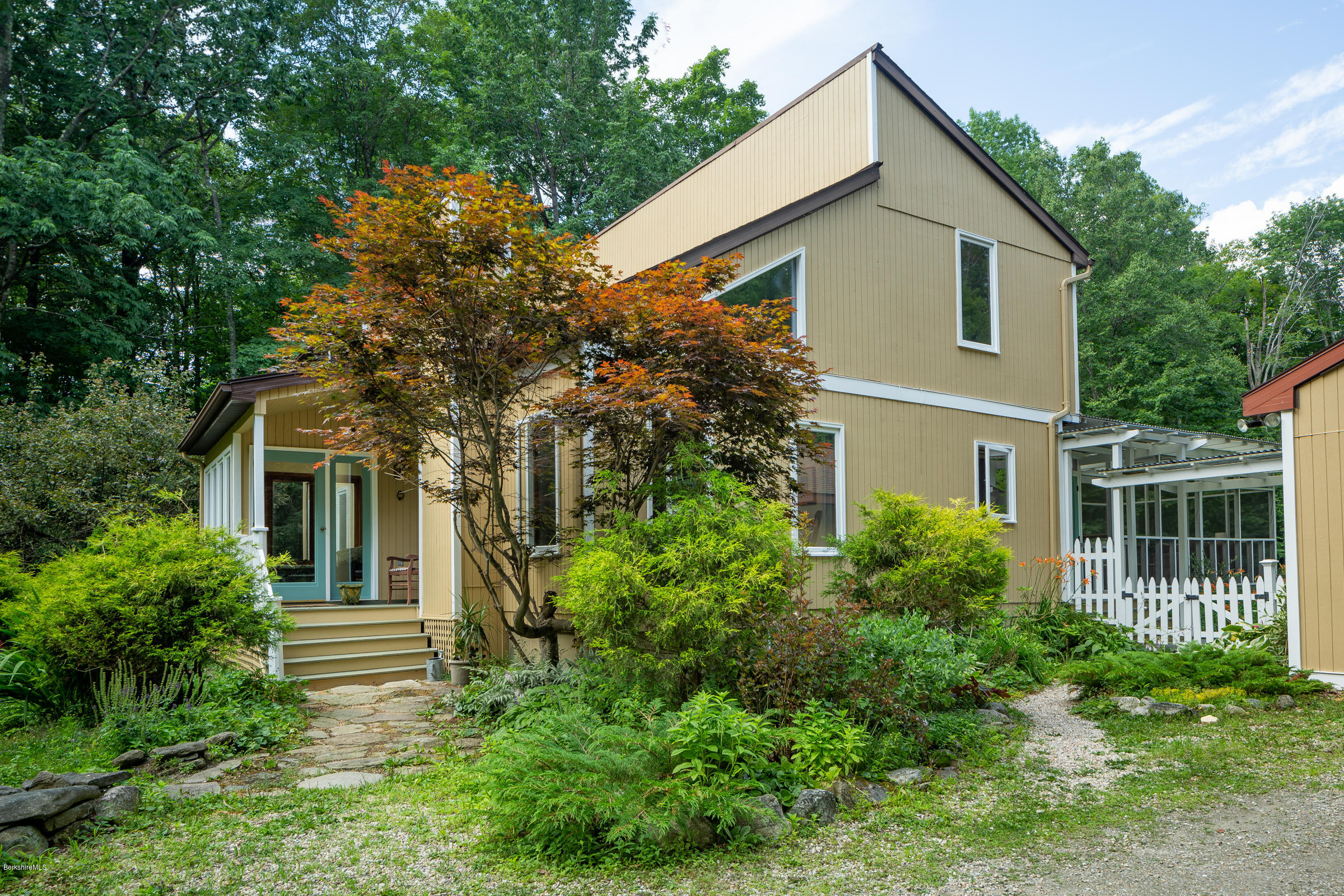 23 Griswold Road Monterey, MA 01245 - Photo 3 of 23 a front view of a house with plants and garden