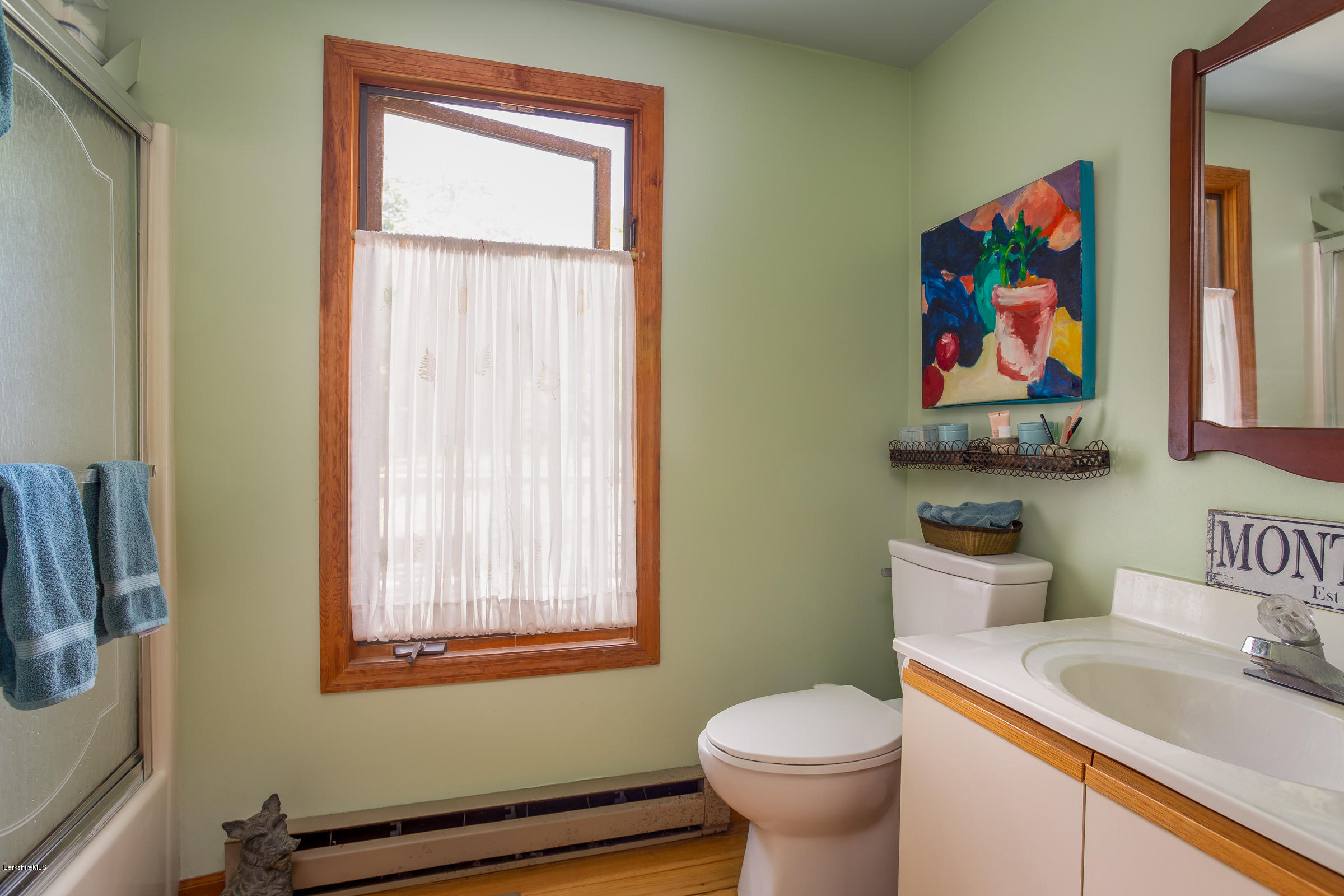 23 Griswold Road Monterey, MA 01245 - Photo 21 of 23 a bathroom with a toilet a sink and a window