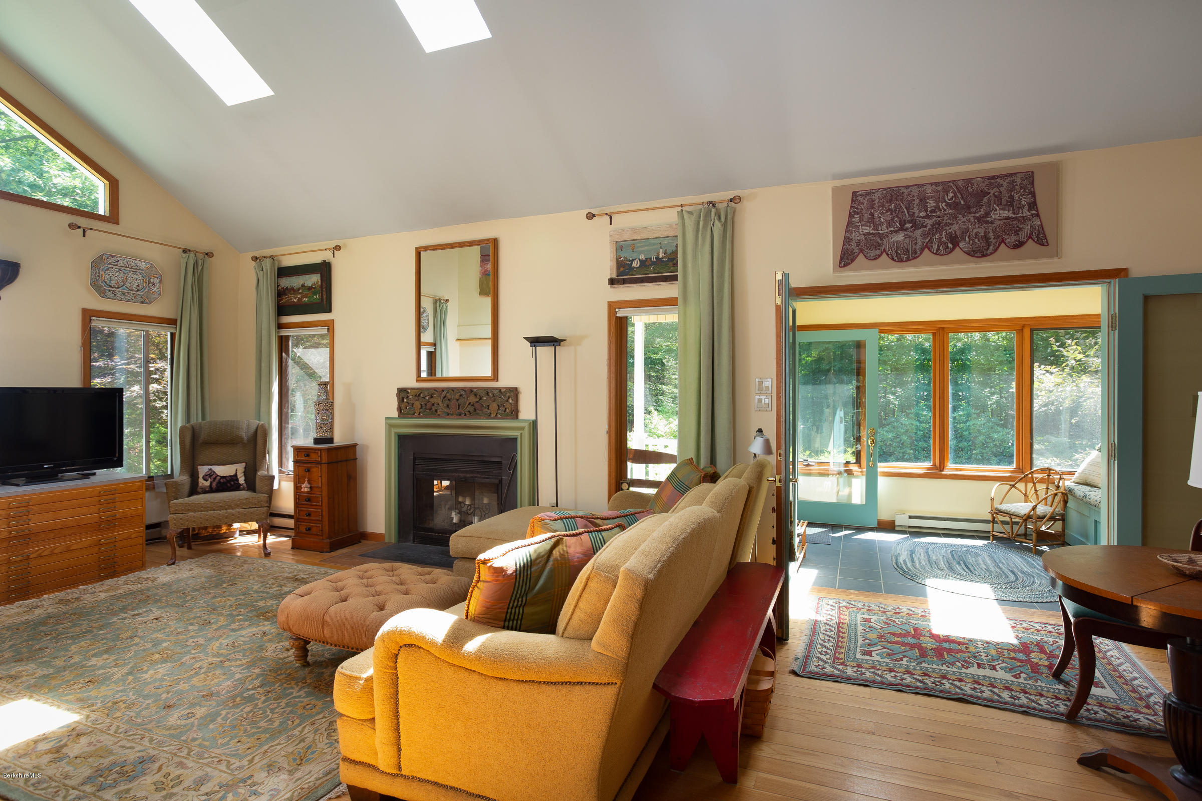 23 Griswold Road Monterey, MA 01245 - Photo 7 of 23 a living room with furniture a fireplace and a flat screen tv