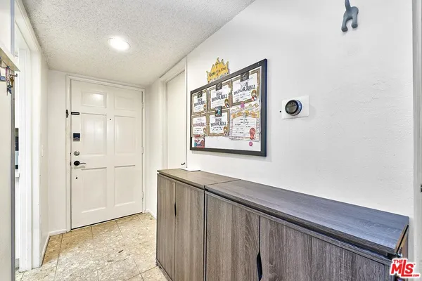 a view of a hallway with closet area