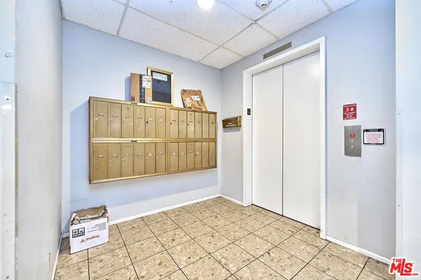 a view of a hallway with entryway door