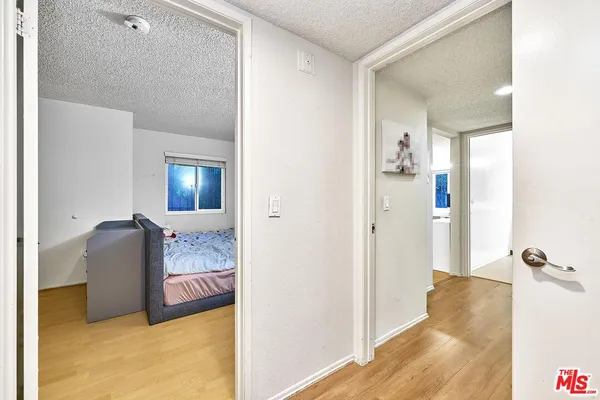 a view of a bedroom from a hallway