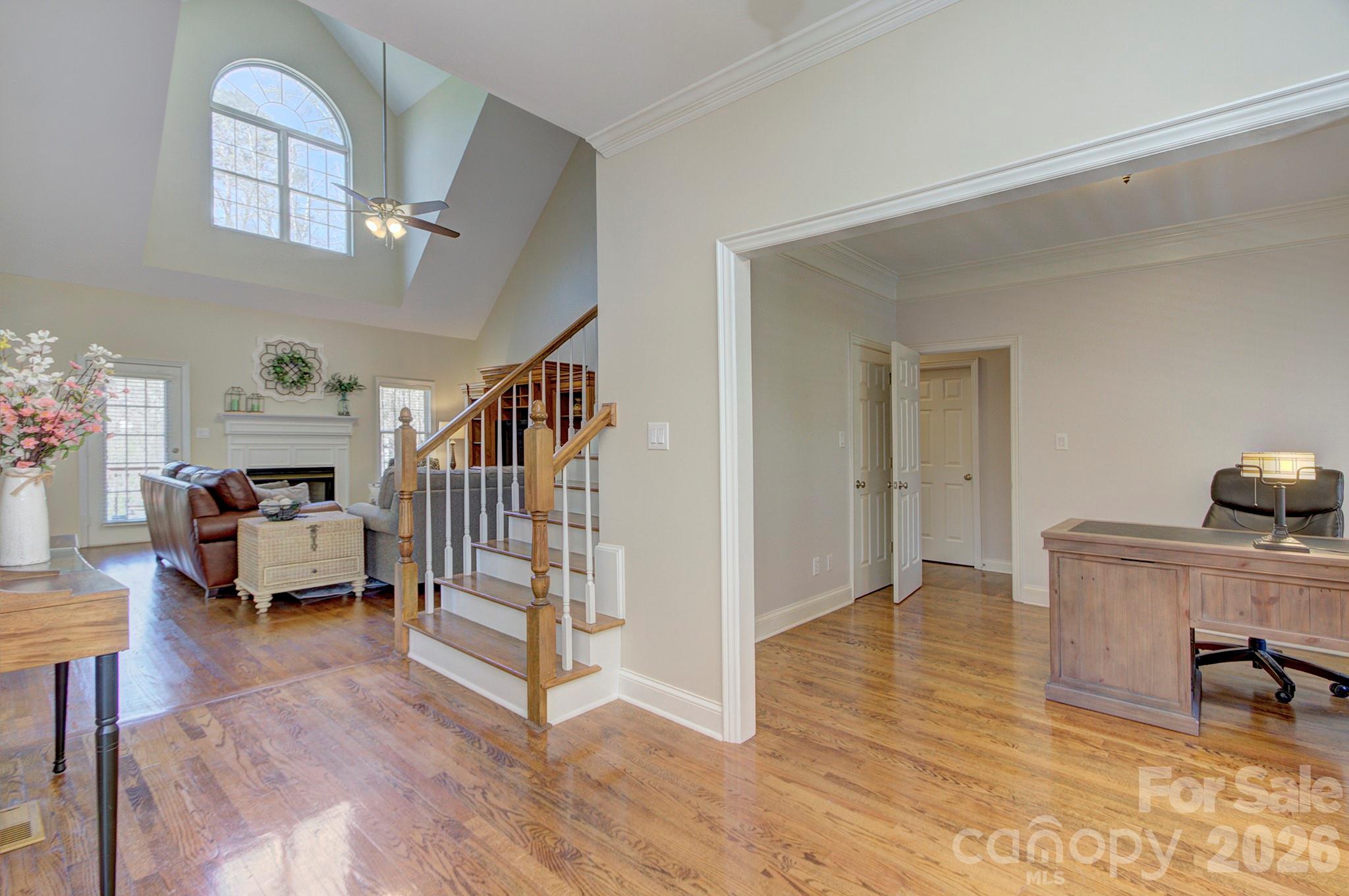 4839 Antioch Church Road Matthews, NC 28104 - Photo 11 of 36 a view of entryway livingroom and hall with wooden floor