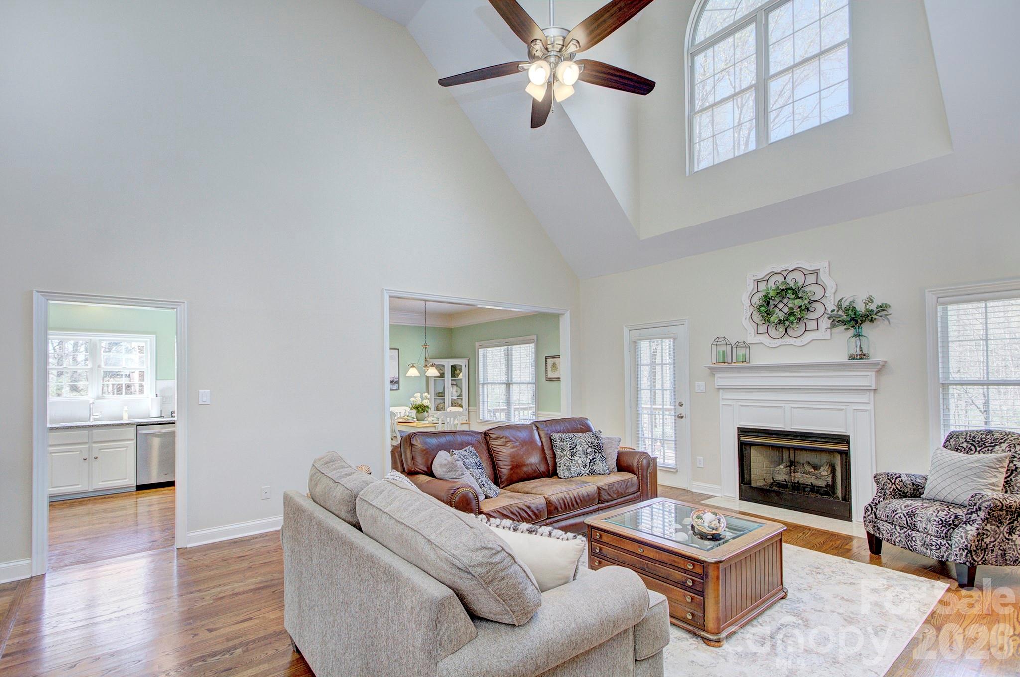 4839 Antioch Church Road Matthews, NC 28104 - Photo 13 of 36 a living room with furniture and a fireplace