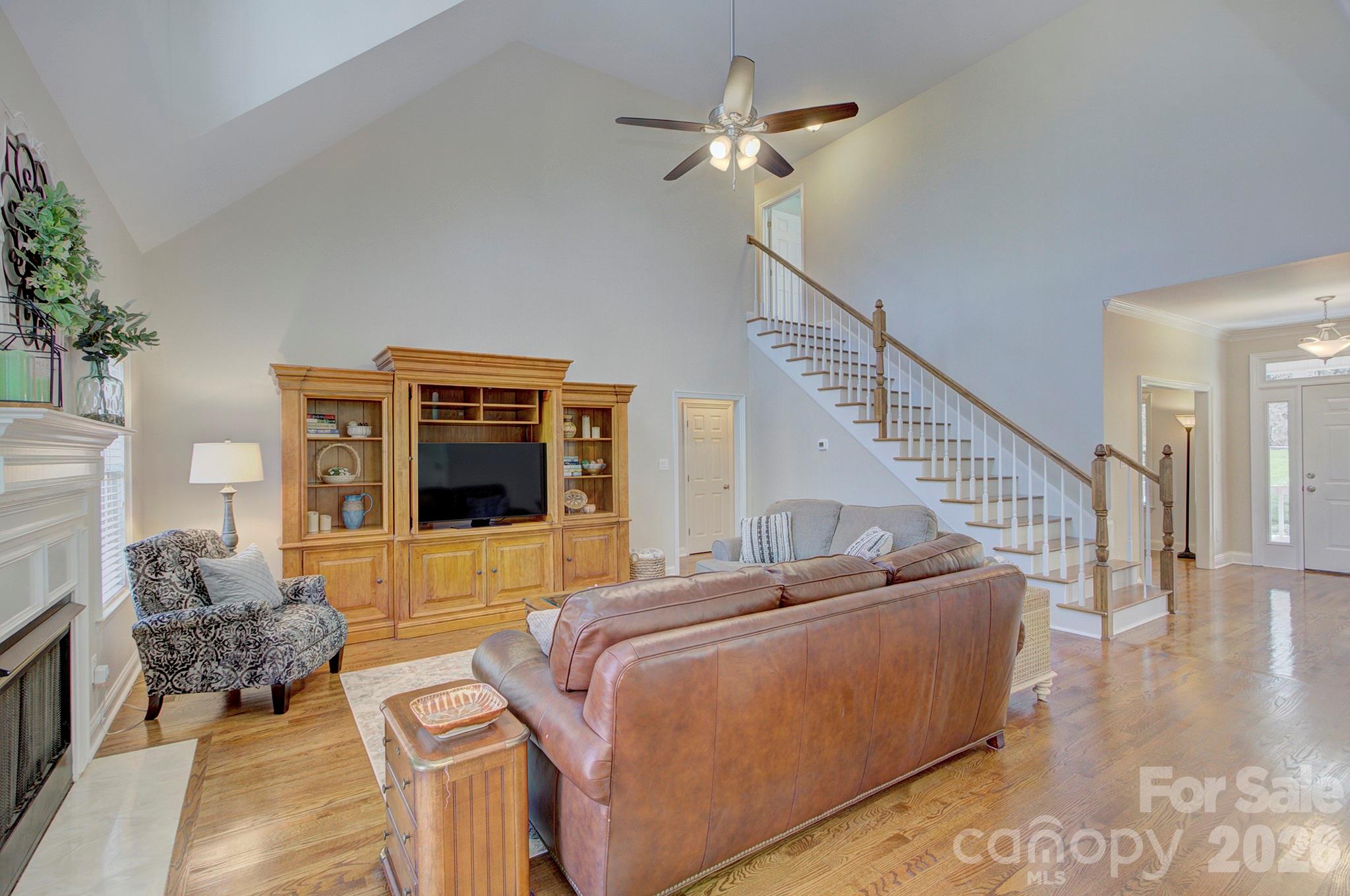4839 Antioch Church Road Matthews, NC 28104 - Photo 14 of 36 a living room with furniture and a flat screen tv