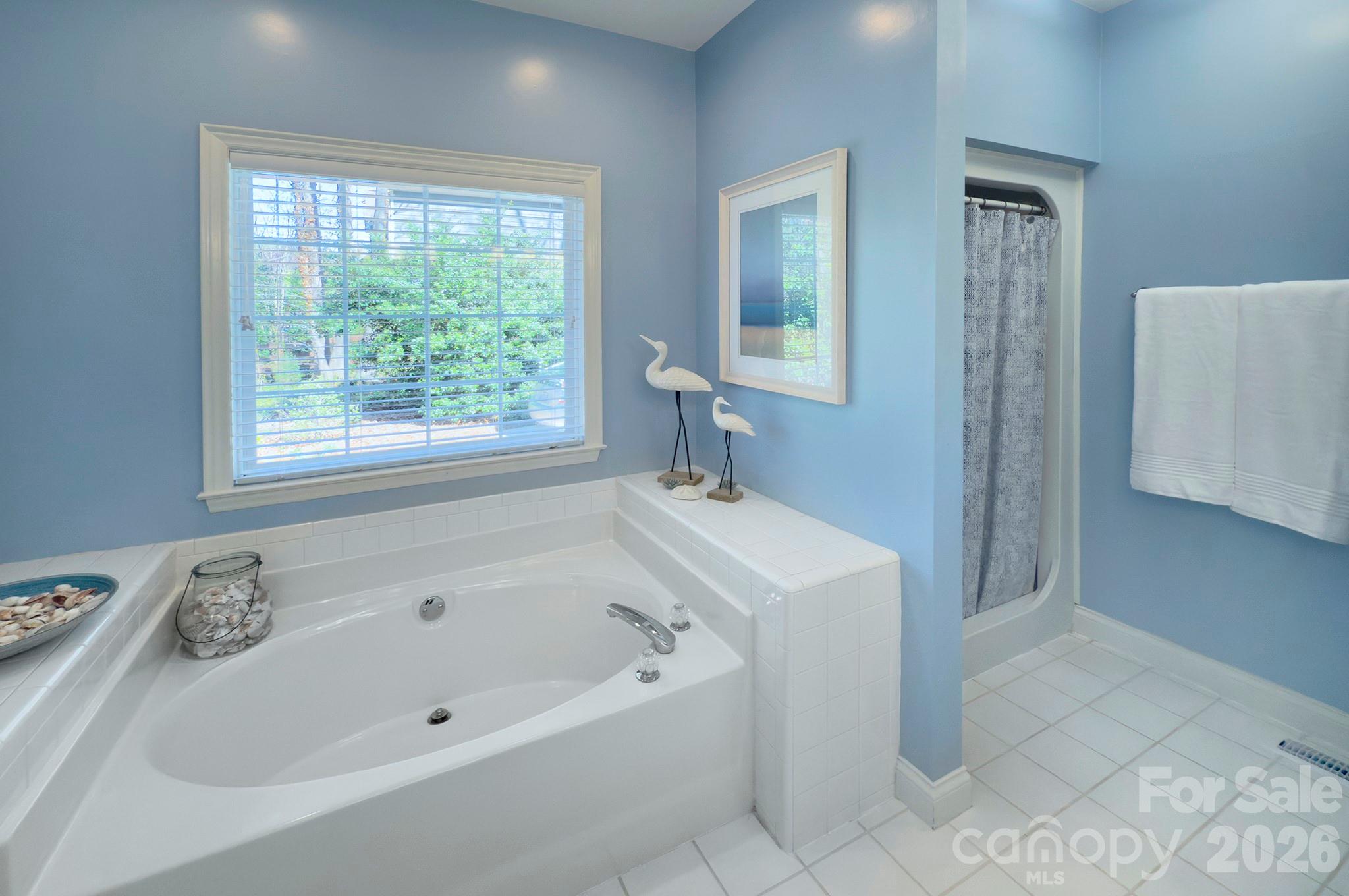 4839 Antioch Church Road Matthews, NC 28104 - Photo 25 of 36 a white bath tub sitting next to a window