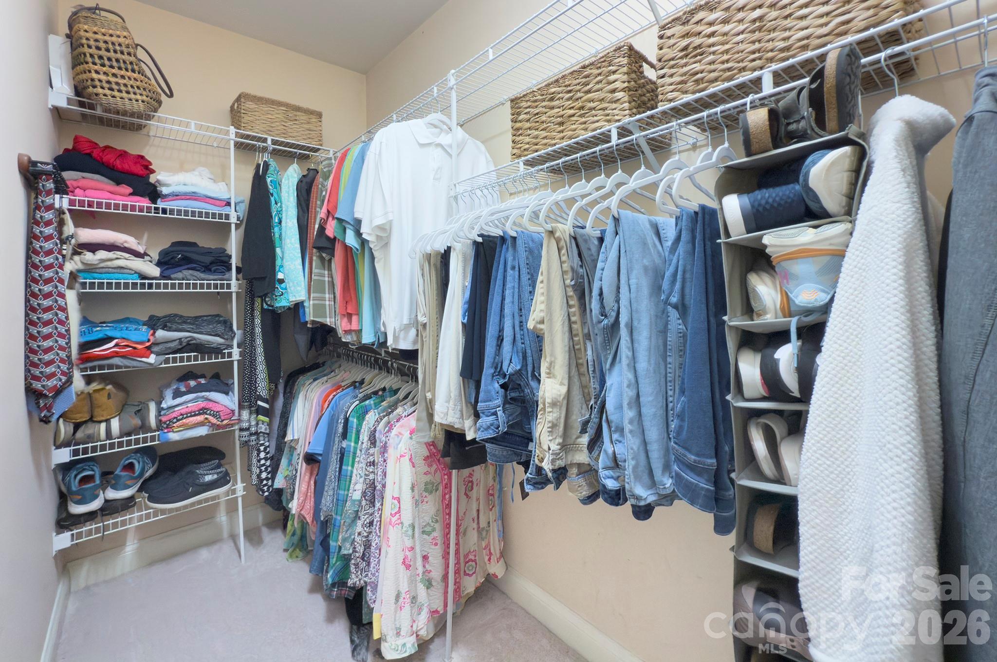 4839 Antioch Church Road Matthews, NC 28104 - Photo 27 of 36 a view of walk in closet with clothes and shoes