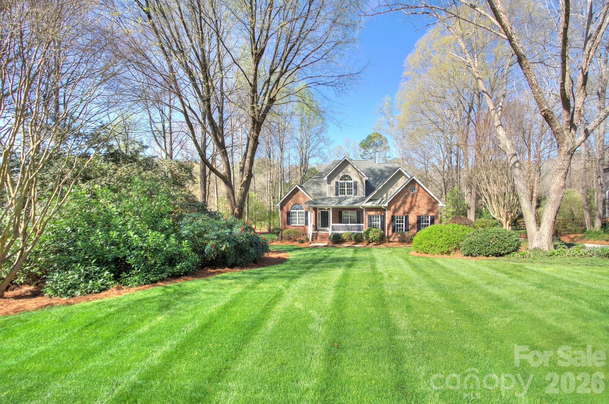 4839 Antioch Church Road Matthews, NC 28104 - Photo 3 of 36 a front view of a house with yard and green space