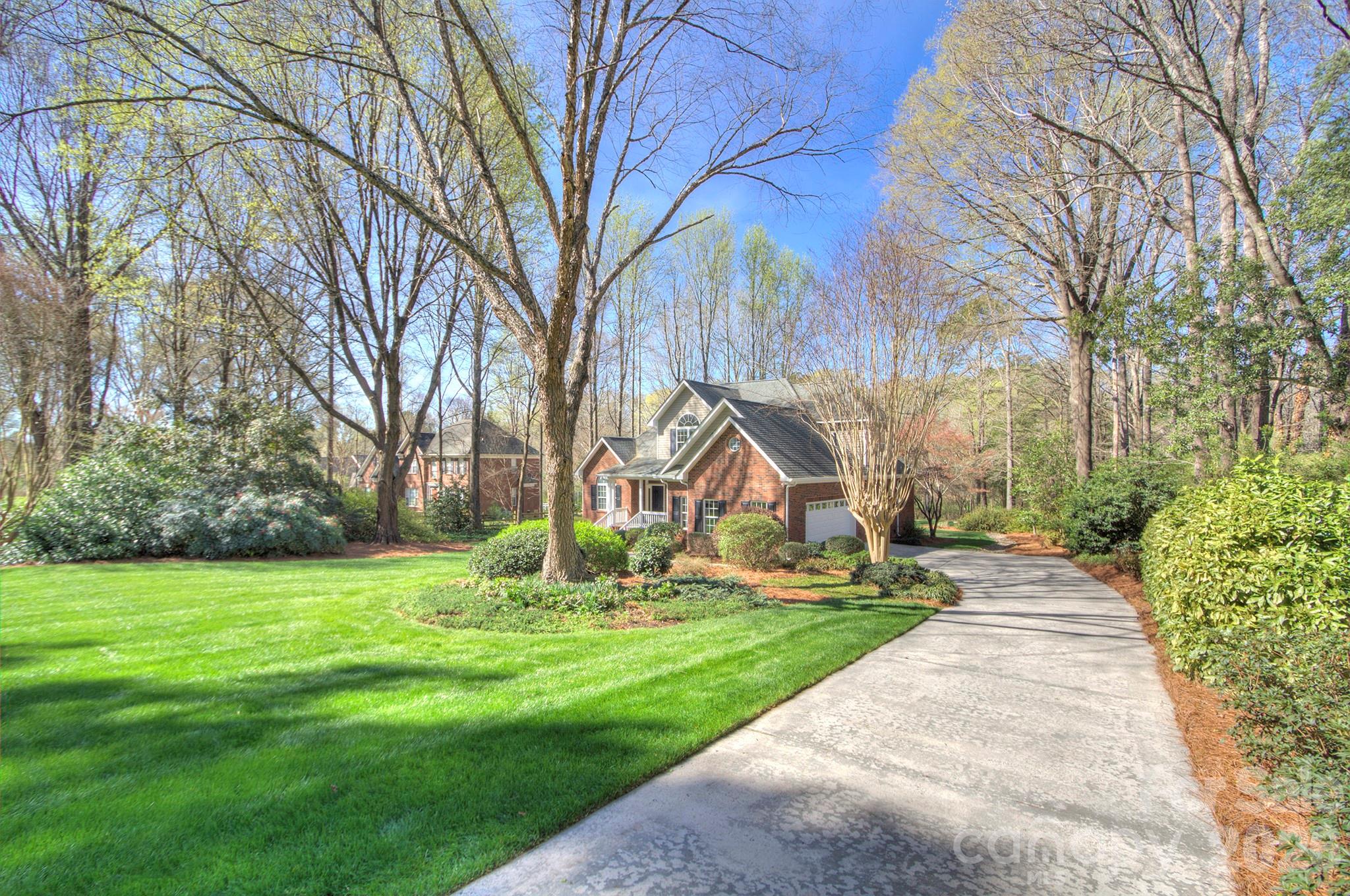4839 Antioch Church Road Matthews, NC 28104 - Photo 5 of 36 a view of a playground with a small plants and trees