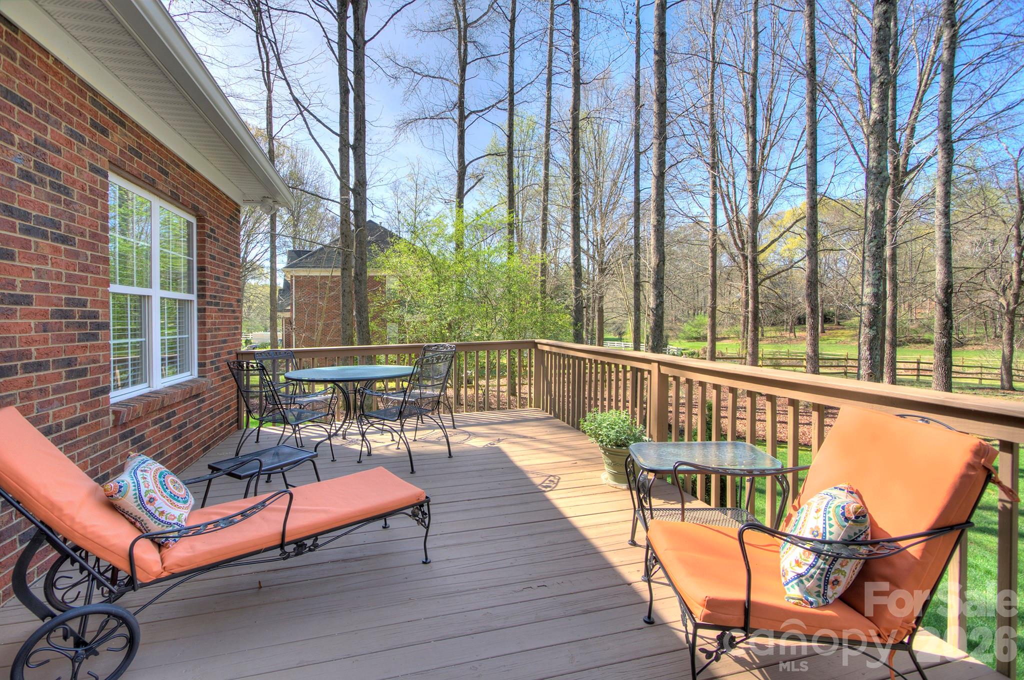 4839 Antioch Church Road Matthews, NC 28104 - Photo 6 of 36 a view of a chairs on wooden deck