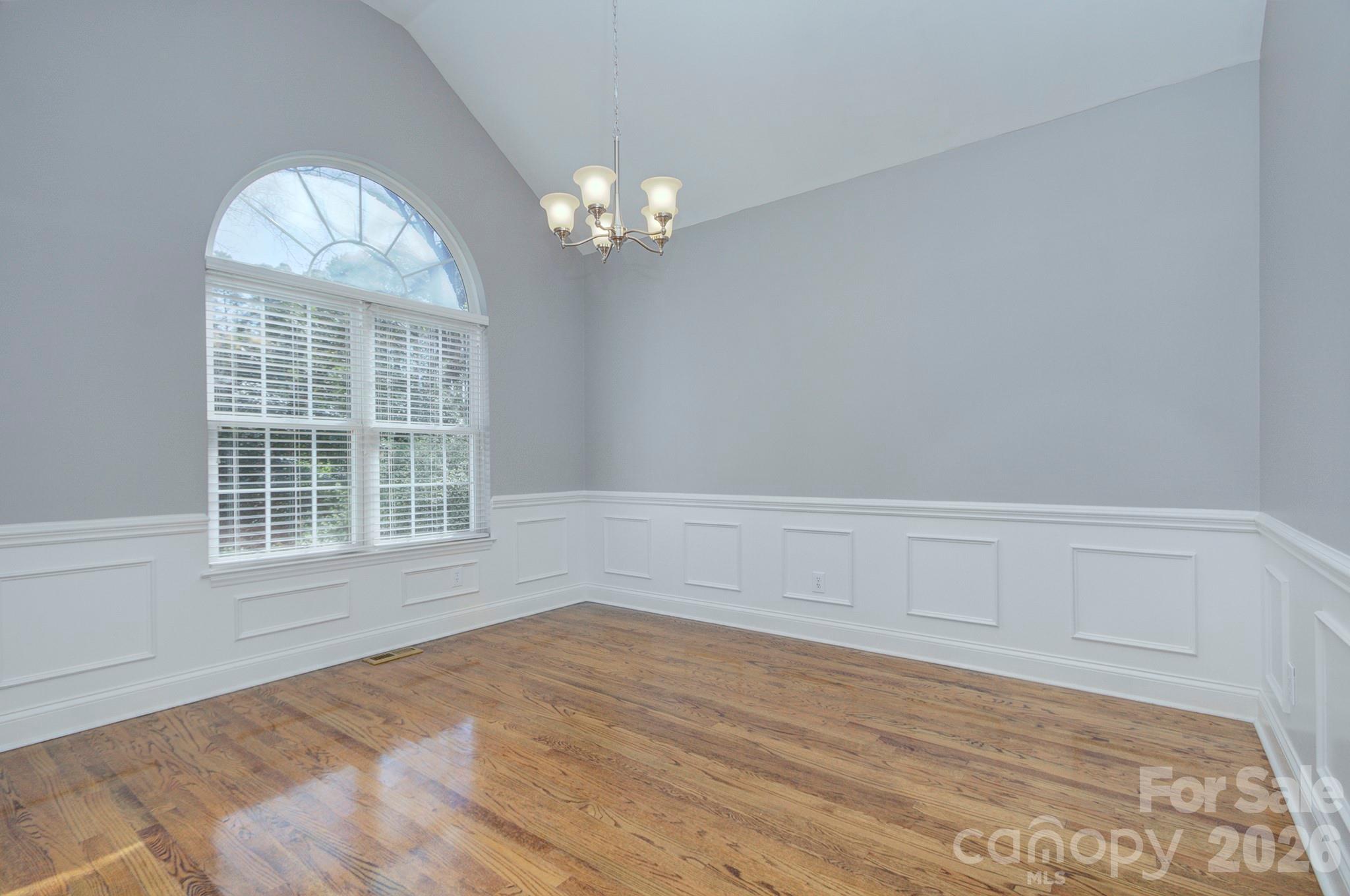 4839 Antioch Church Road Matthews, NC 28104 - Photo 9 of 36 a view of empty room with wooden floor and fan