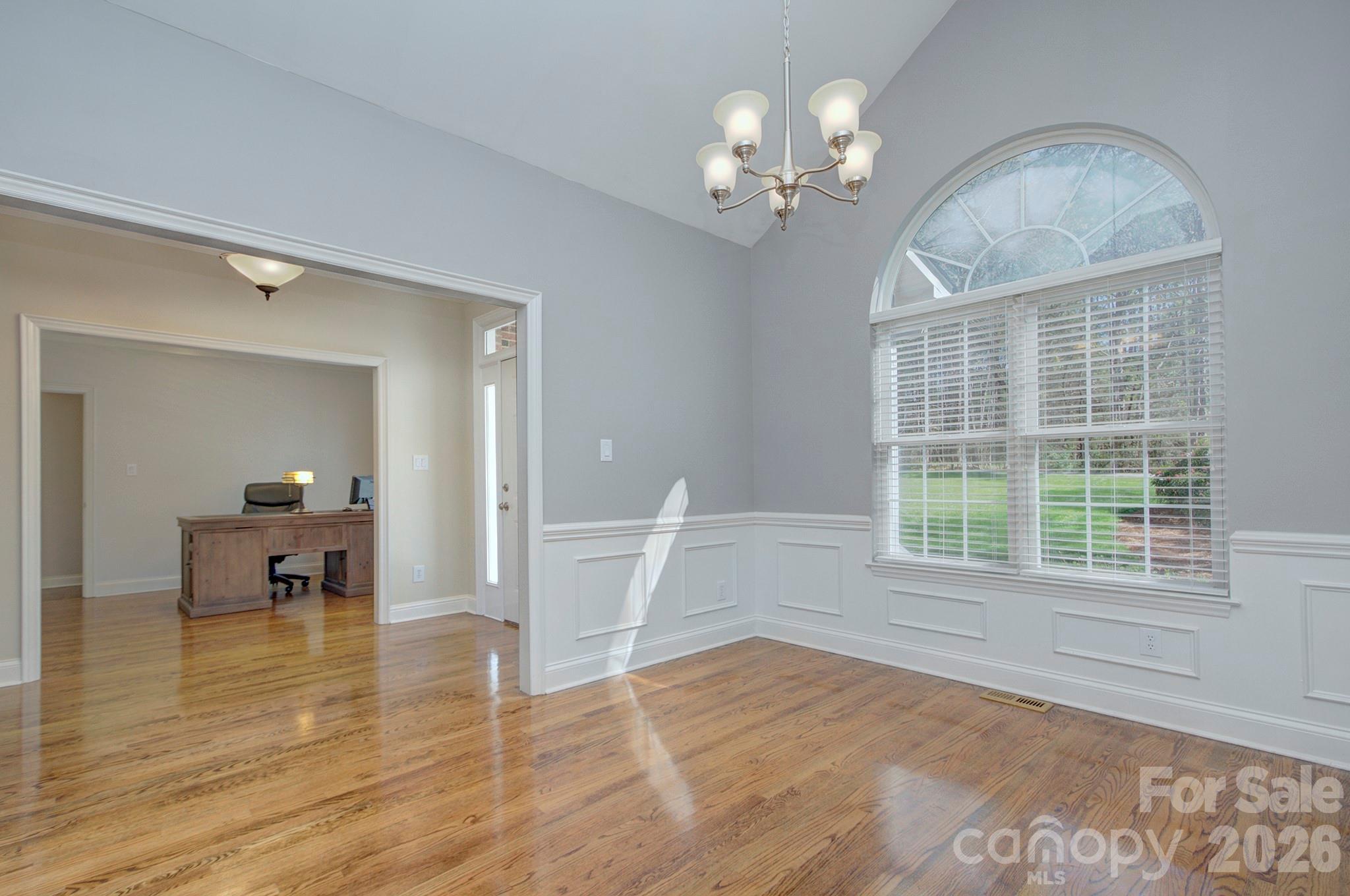 4839 Antioch Church Road Matthews, NC 28104 - Photo 10 of 36 a view of empty room with wooden floor and fan
