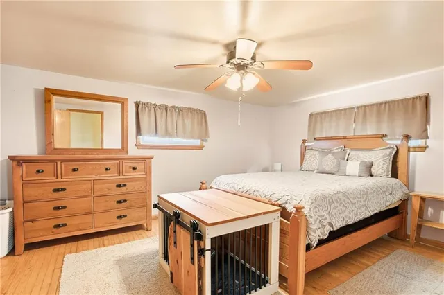 a bedroom with a bed and a dresser