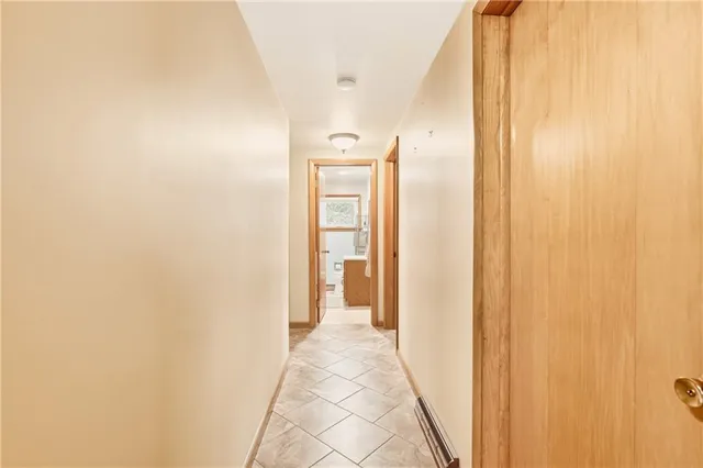 a view of a bathroom from a hallway