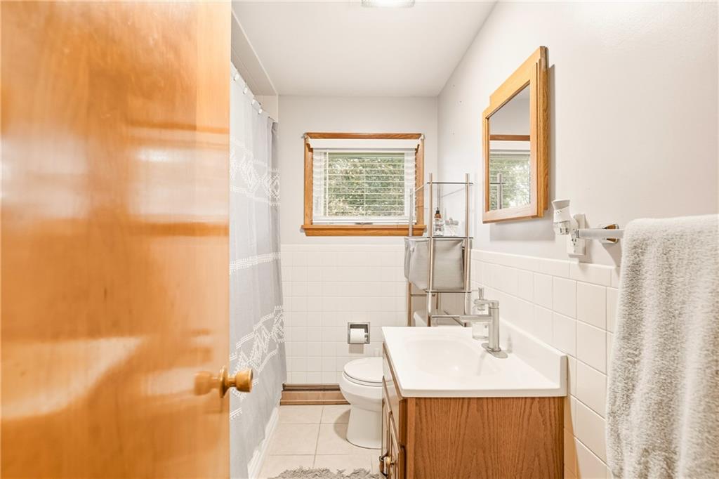 309 High Street Berlin, PA 15530 - Photo 18 of 36 a bathroom with a sink vanity mirror and tub