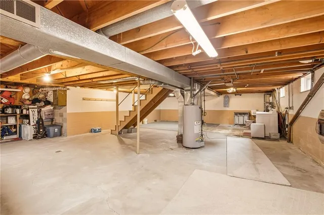 a view of an empty room with gym equipment