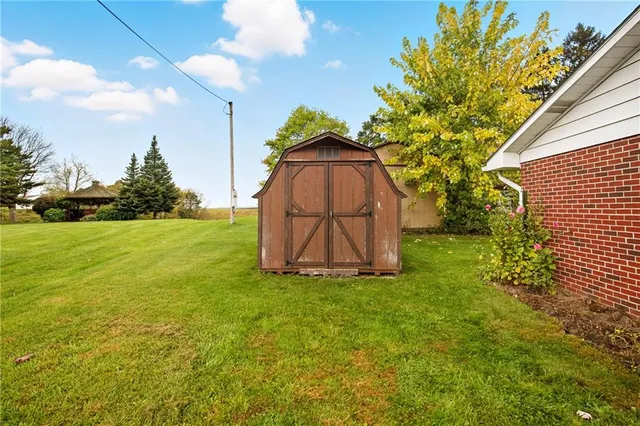 a view of a tree in front of a house