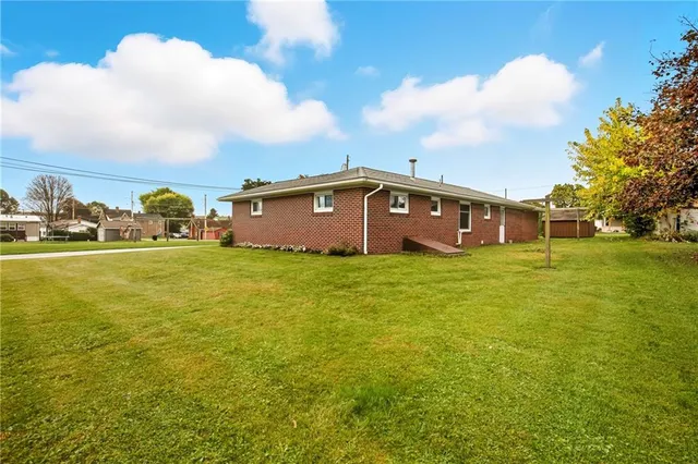 a view of a big room with yard and staircase