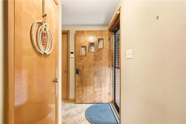 a bathroom with a granite countertop shower and a mirror