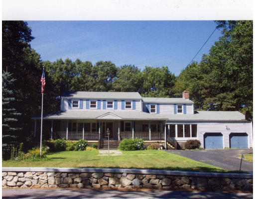 389 High Plain Road Andover, MA 01810 - Photo 1 of 1 a front view of a house with a garden and sitting area
