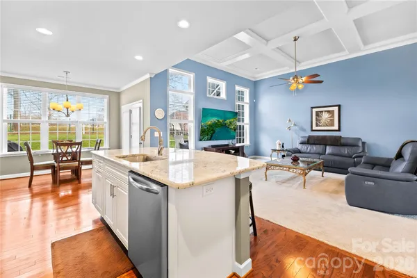 a kitchen with stainless steel appliances granite countertop a sink and stove