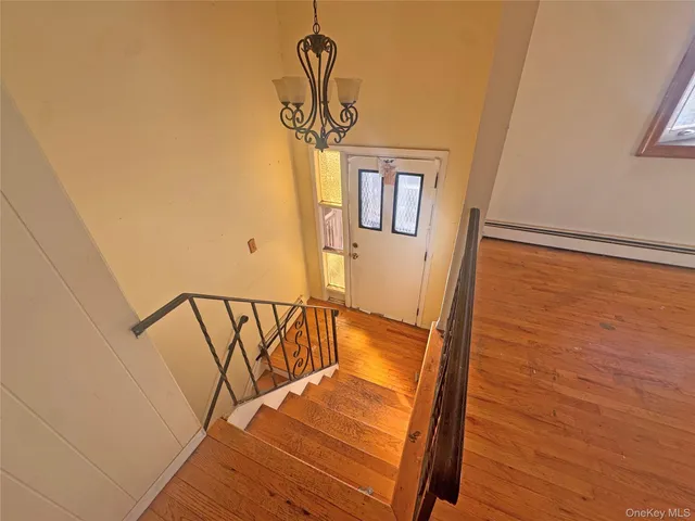 a view of entryway with wooden floor