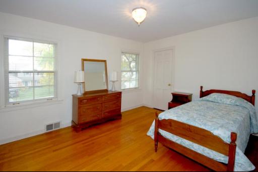 933 Pontiac Road Wilmette, IL 60091 - Photo 10 of 16 a bedroom with furniture and window