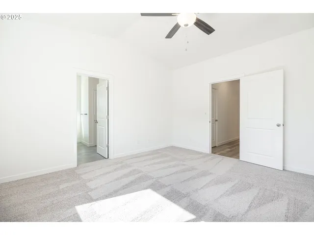 a bathroom with a double vanity sink mirror and bathtub