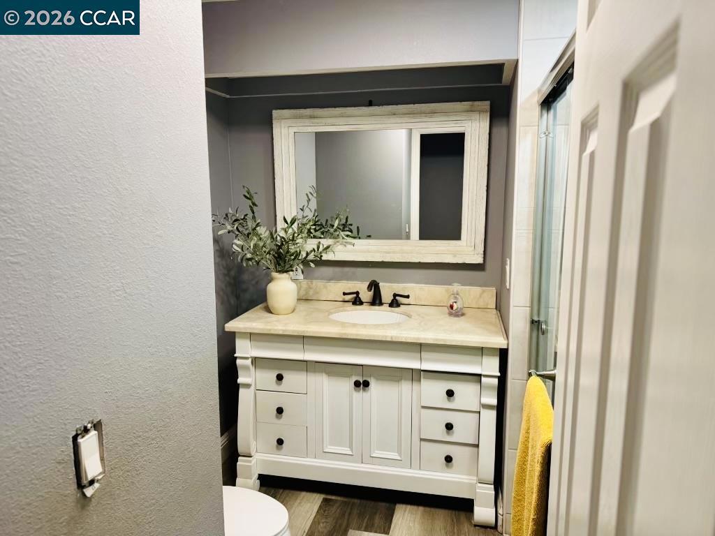 4400 Gateway Road Bethel Island, CA 94511 - Photo 4 of 6 a bathroom with a granite countertop sink and a mirror