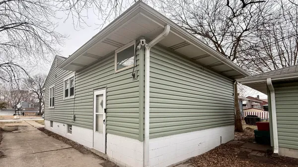 a view of a house with a yard and garage