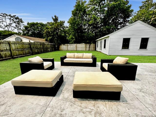 275 Sound Road Greenport, NY 11944 - Photo 9 of 33 Fenced backyard with an outdoor hangout area and a patio area