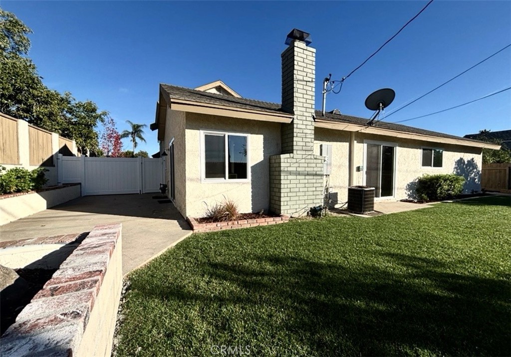 6210 Halstead Avenue, Unit A Rancho Cucamonga, CA 91701 - Photo 14 of 32 a front view of a house with a yard