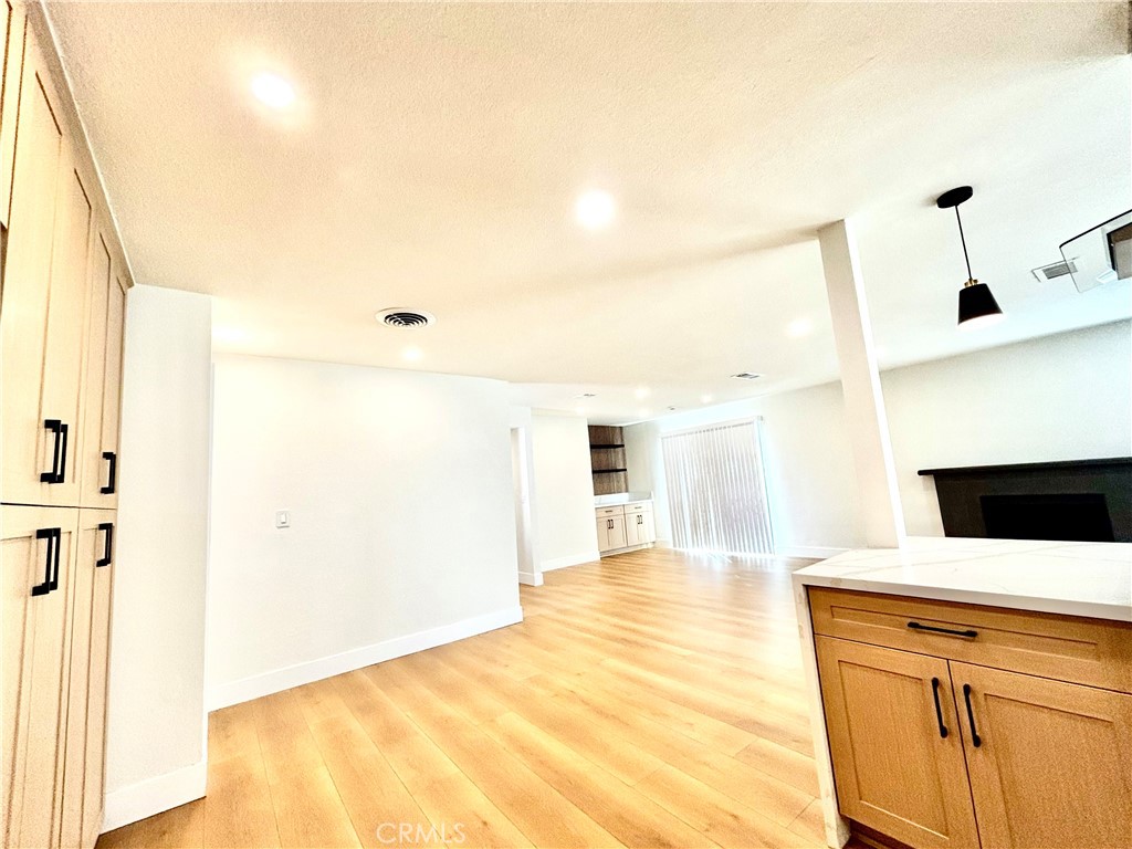6210 Halstead Avenue, Unit A Rancho Cucamonga, CA 91701 - Photo 19 of 32 a view of a kitchen cabinets and wooden floor