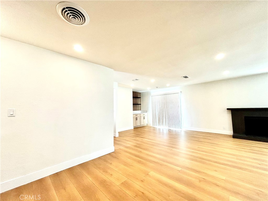 6210 Halstead Avenue, Unit A Rancho Cucamonga, CA 91701 - Photo 20 of 32 a view of empty room with wooden floor